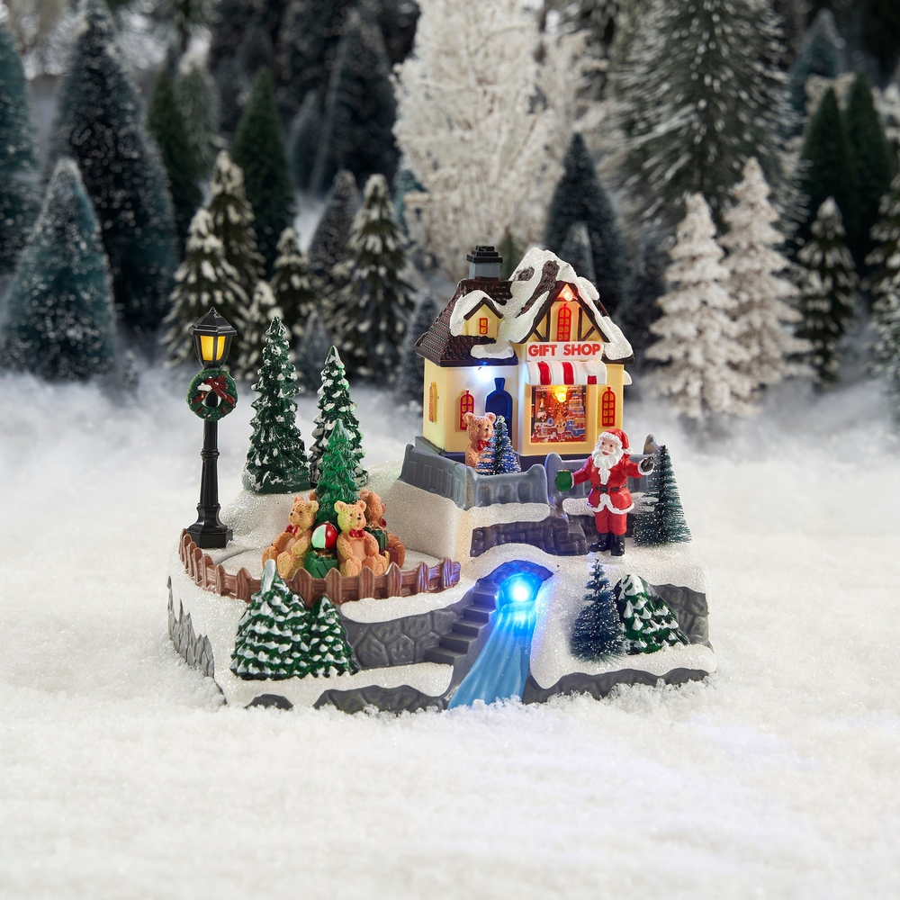 Scène de Noël animée sur batterie, magasin et cadeaux - H.16,5cm résistant aux intempéries