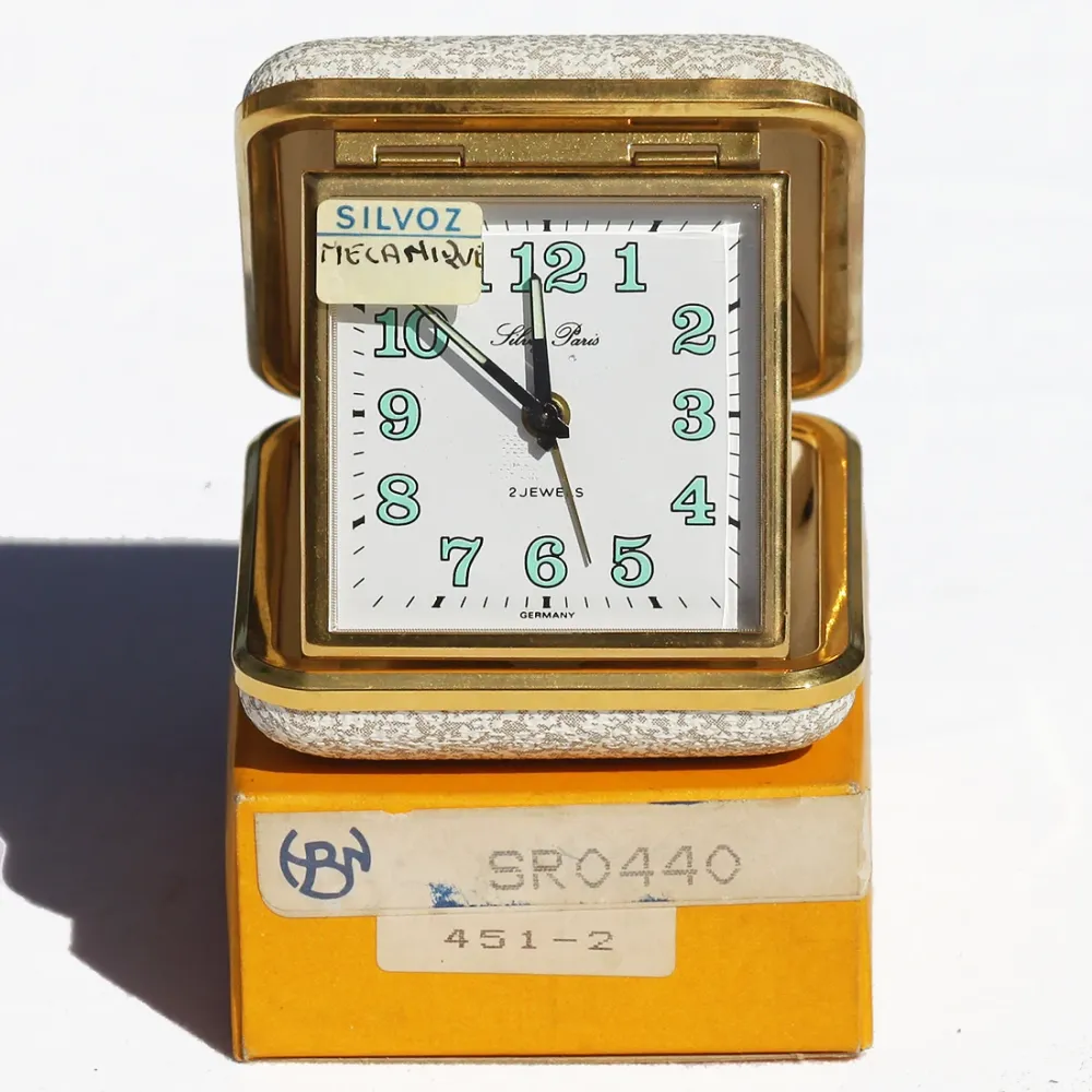Réveil de voyage mécanique vintage Silvoz Paris en boîte ( comme neuf )