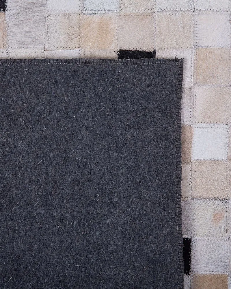 Tapis en cuir 160 x 230 cm noir et naturel ERFELEK
